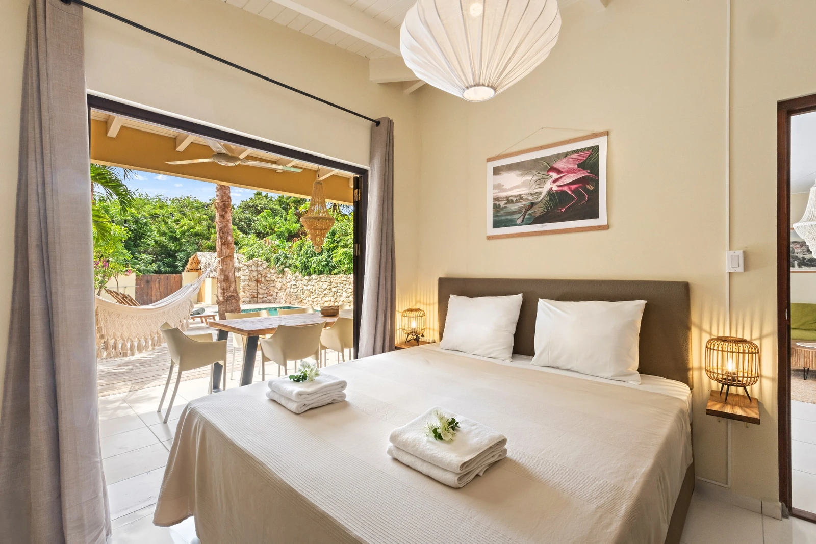 Bright bedroom opening onto the garden